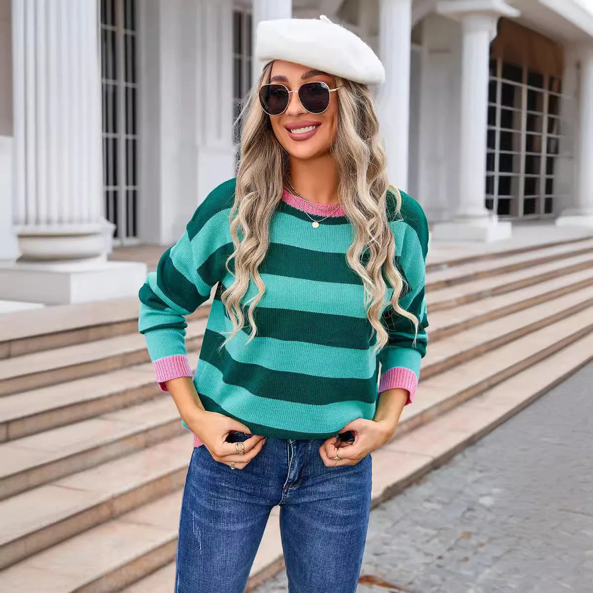 Women's loose long sleeve acrylic sweater in blue with stripes, round neck.