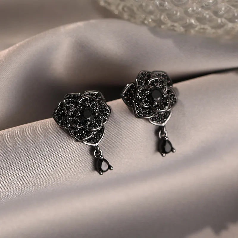 Women's rose gold plated flower ear studs with black zircon stones
