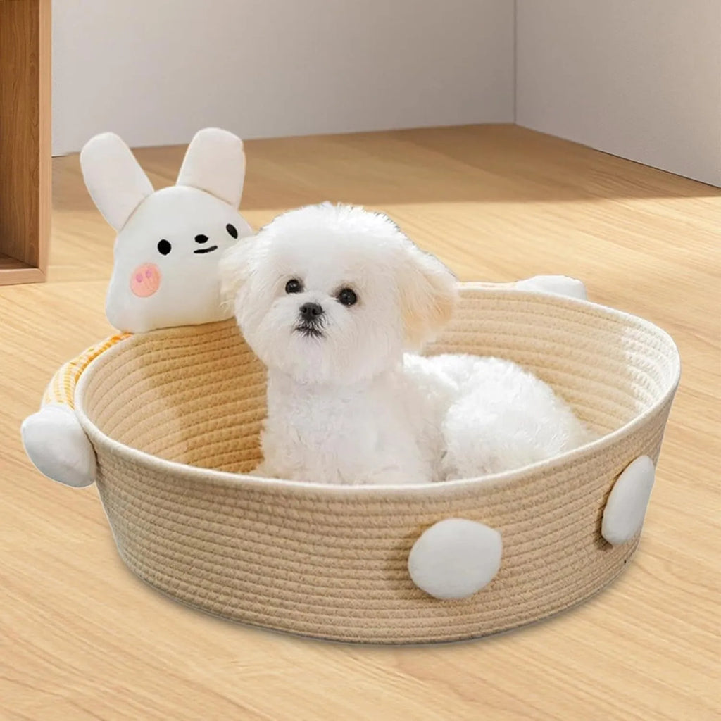 Woven cotton rope basket serving as a cat bed and scratcher in a natural colour.