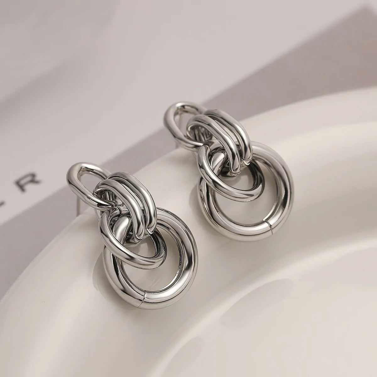 Women's gold geometric earrings with irregular shapes and high-profile metallic style