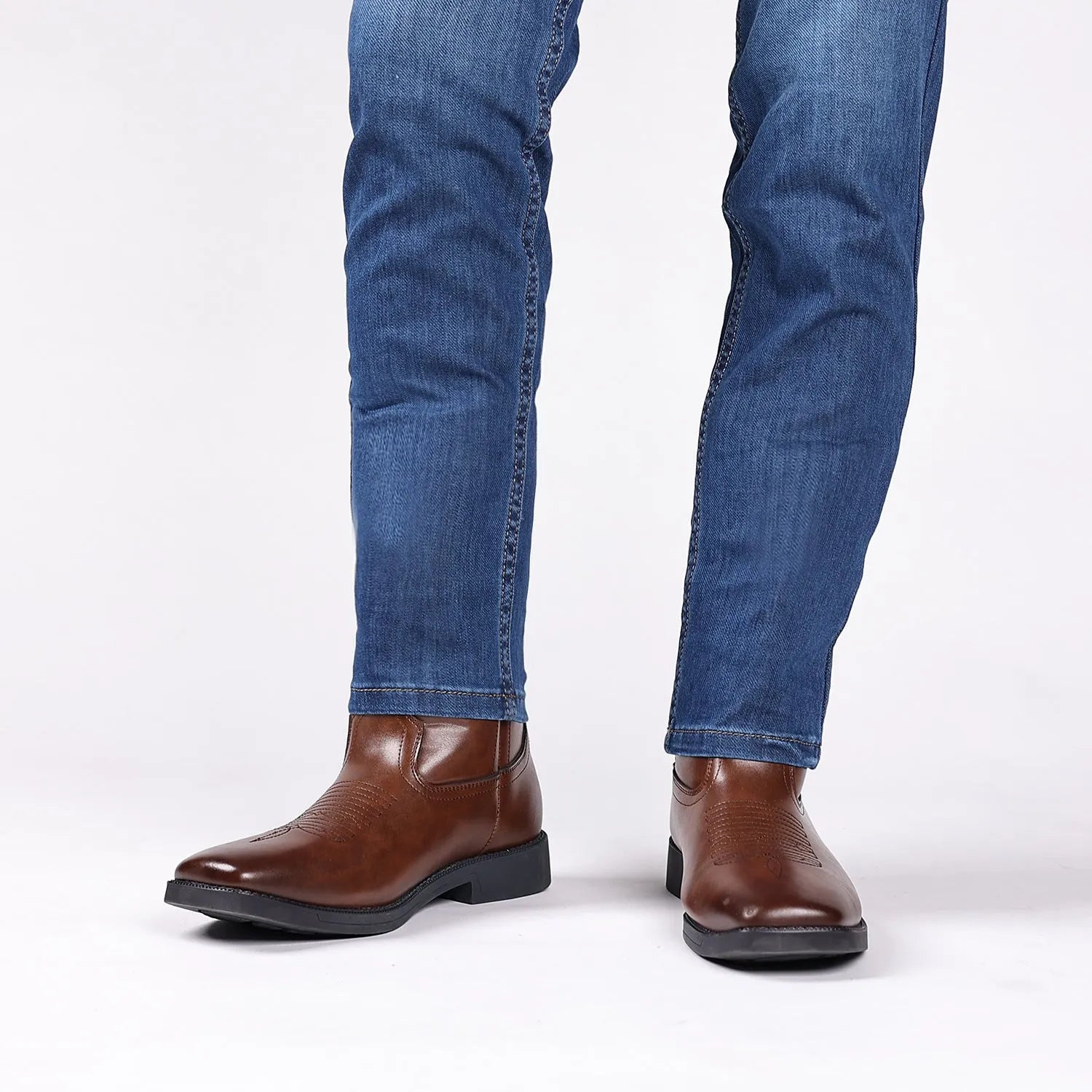 Brown retro cowboy boots with embroidered design, square toe, and high shaft