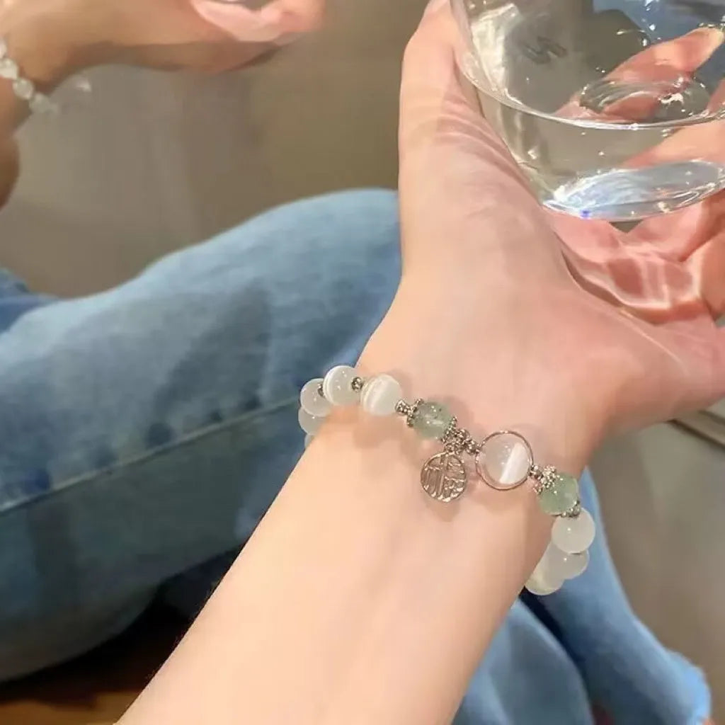 Handcrafted glass butterfly bracelet with drop-shaped moonlight grey beads and special-interest design