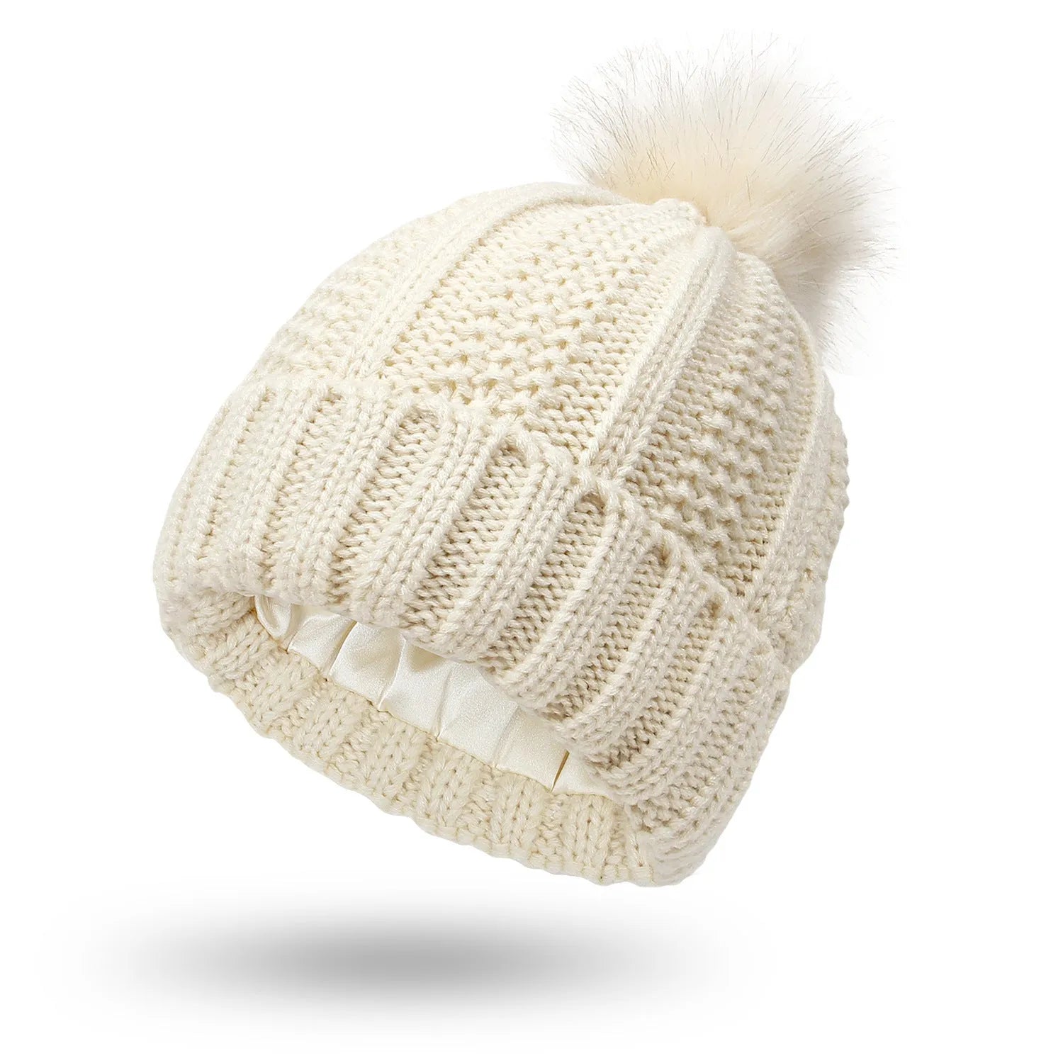 Women's black knit beanie with a faux fur pom pom and satin lining for hair protection
