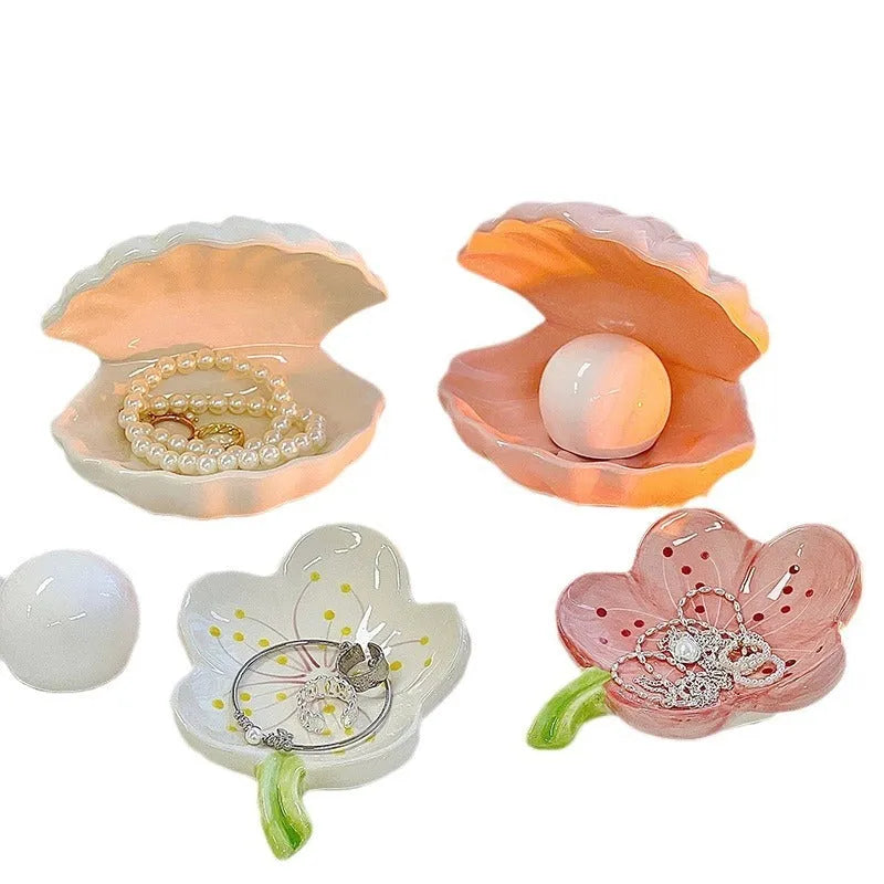 Yellow ceramic ornament tray with a small pink-shell night light placed on it, modern simple style.