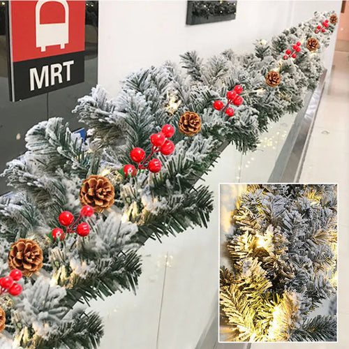 White flocked snow artificial rattan vine Christmas garland on a red background.