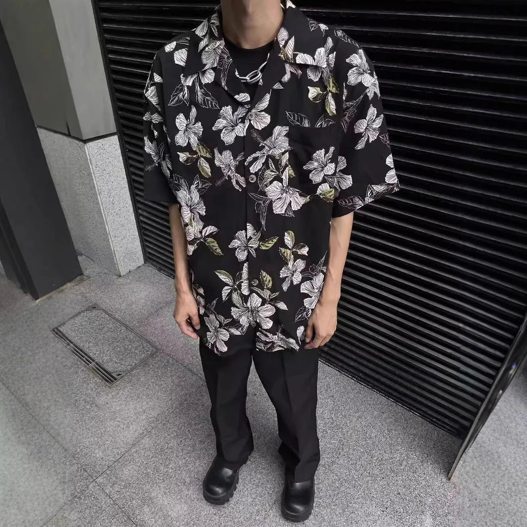 Black men's loose-fit ice silk shirt with vintage Cuban collar, short sleeves, and floral print.