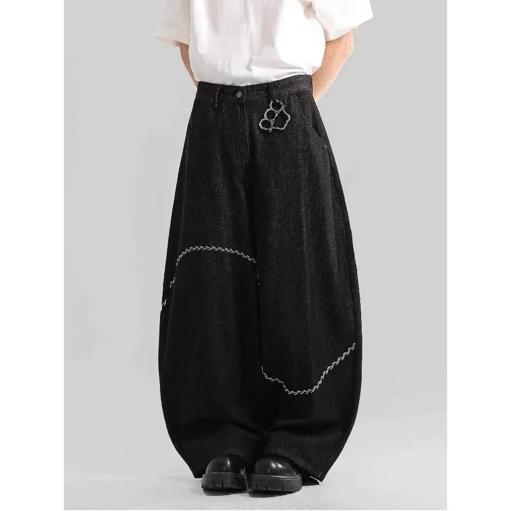 Black straight leg trousers with micro-elastic denim fabric and zip fly opening