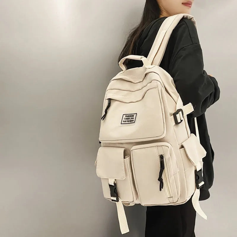 Black and white student backpack with computer compartment showing dimensions 31x12x41cm