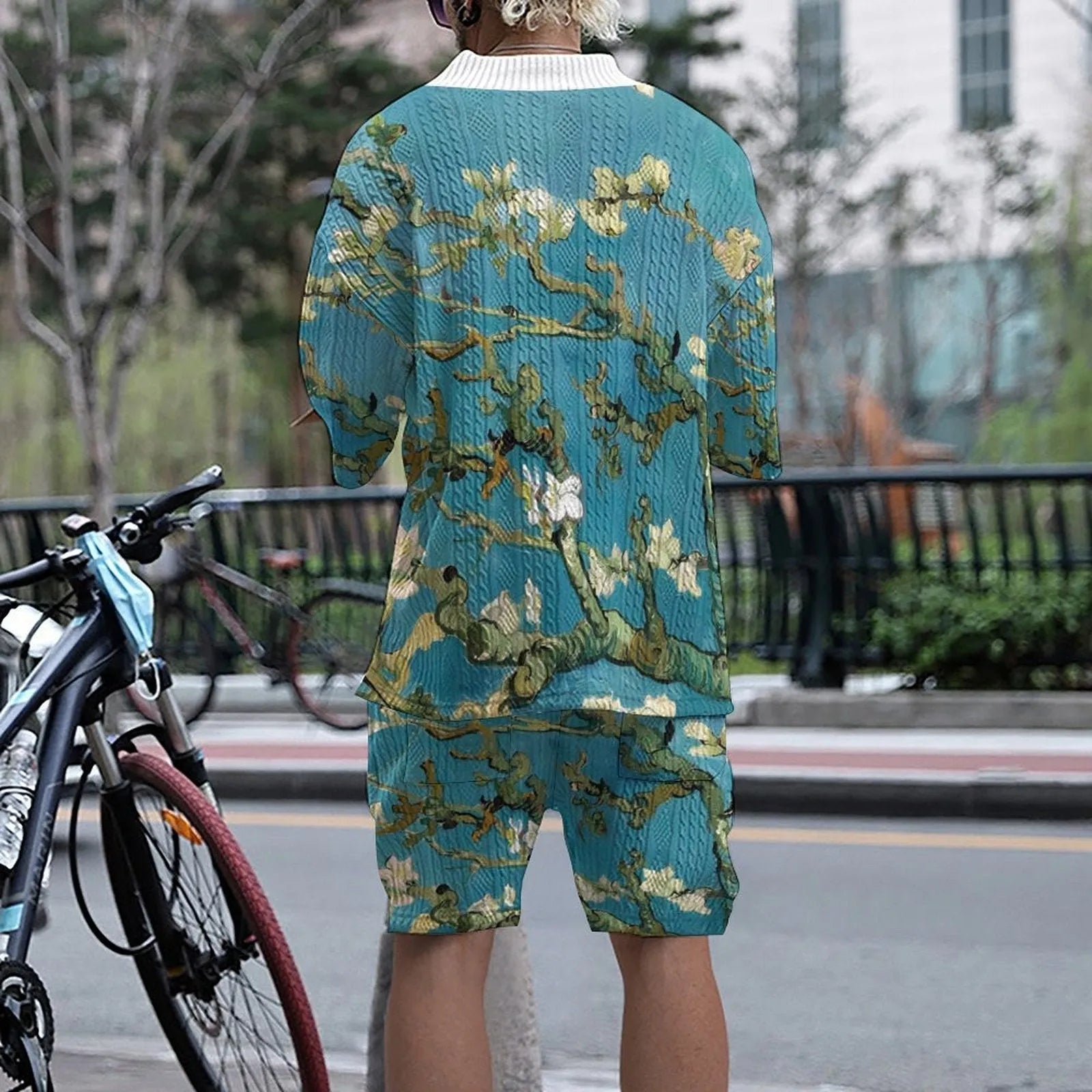 Men's peacock blue knitted shorts suit with 3D printed design showing front view of complete leisurewear set