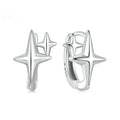 Minimalist oxidised sterling silver ear clips with geometric star designs