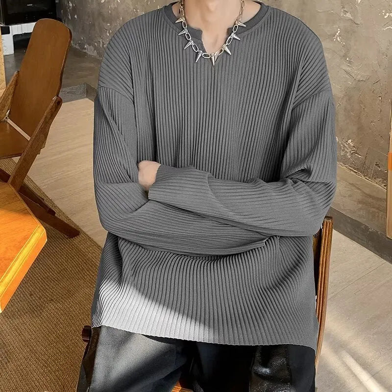 Women's plus size striped texture pullover top in grey, showing loose fit and long sleeves.
