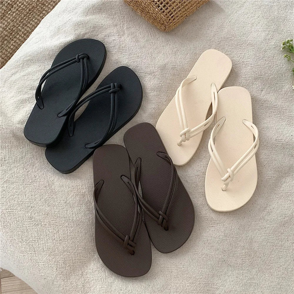 Women's PVC flip flops with toe-covering style and non-slip sole in multiple colours.