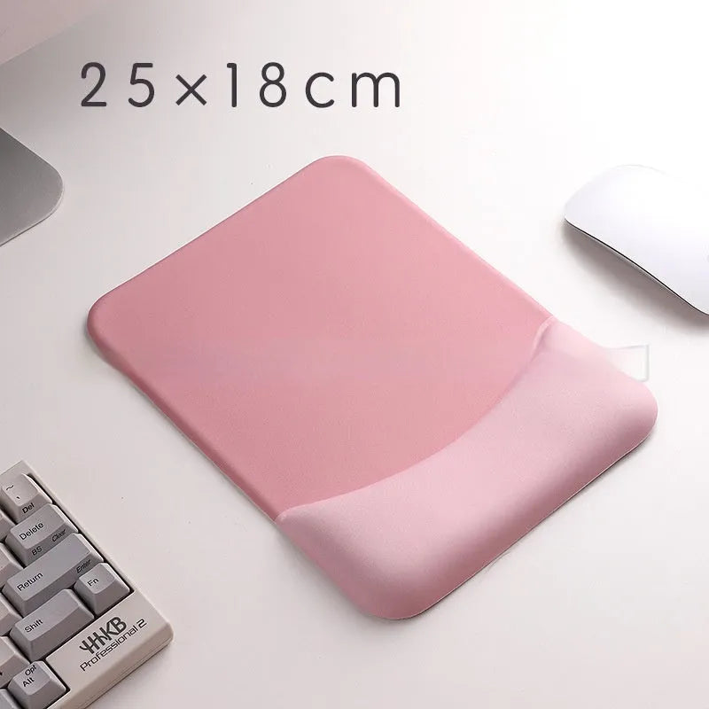 Square silicone wrist rest mouse pad with wrist strap in multiple colour options on a desk