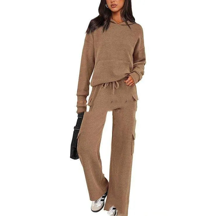 Women's two-piece leisure sports suit in polyester, showing long sleeve top and trousers in a solid colour.