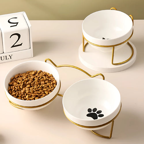 White ceramic pet bowl with decorative pattern in iron frame with cat ear accents
