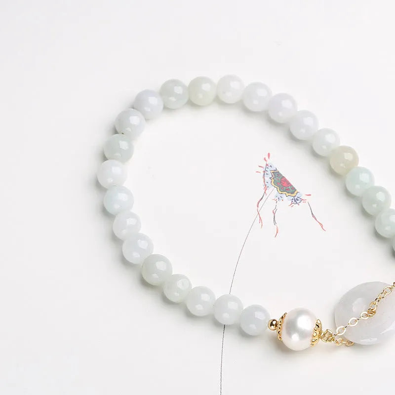 Jade and pearl bracelet with emerald peace buckle clasp and round pendant
