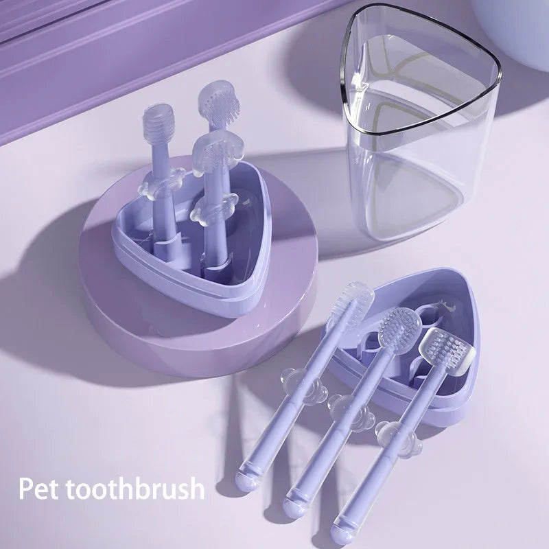 Pet toothbrush with flexible silicone brush head in blue, green, and purple colours for cat and dog dental care