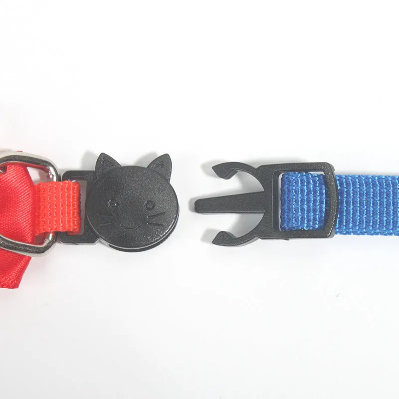 Adjustable striped nylon cat collar with a bell shown in multiple colours including red, blue, green, and pink.