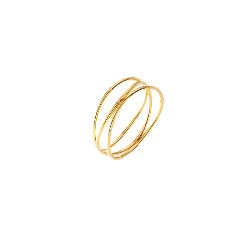 Gold titanium steel ring with a three-layer geometric coil line design on a finger.