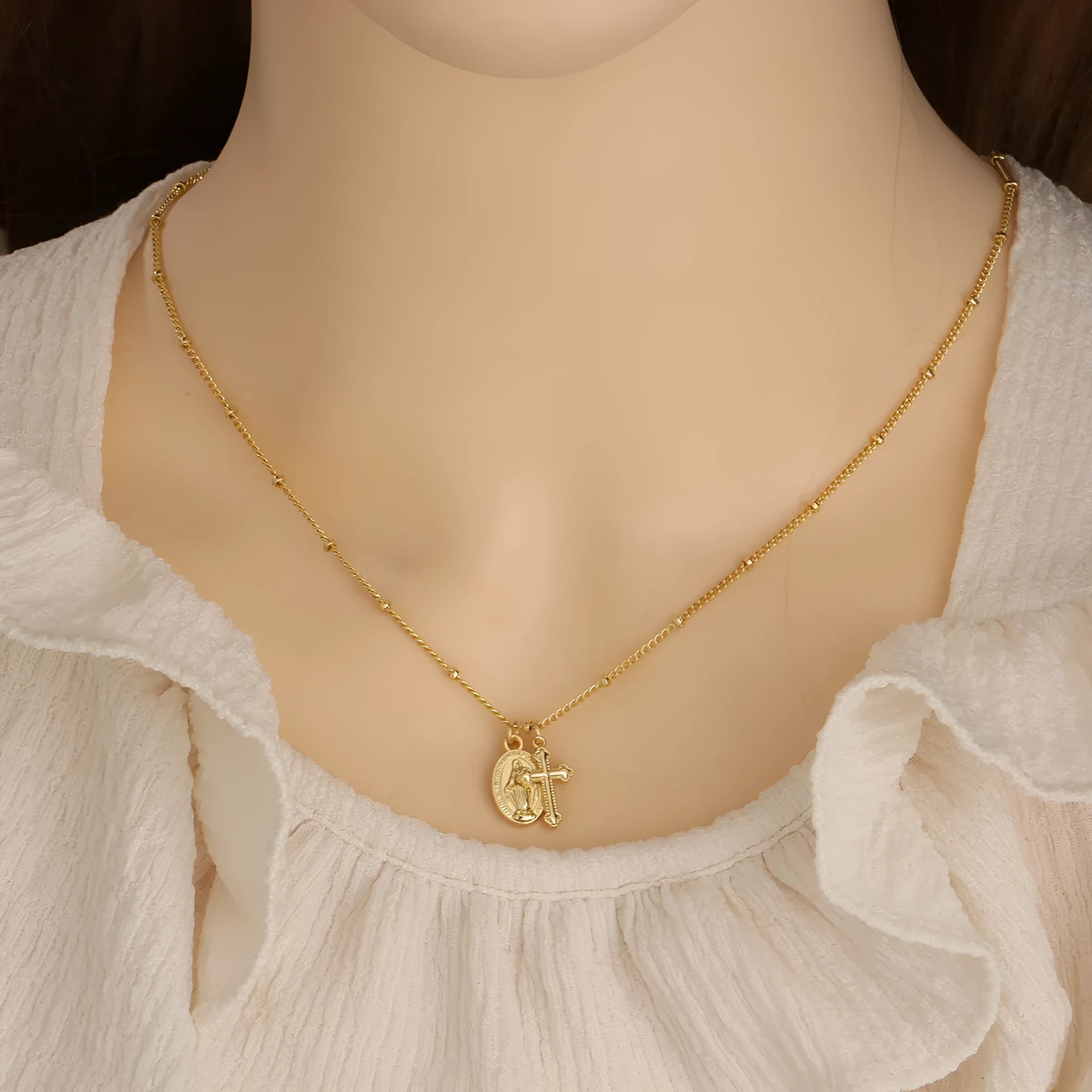Gold Virgin Mary cross necklace with geometric pendant on 18K copper chain