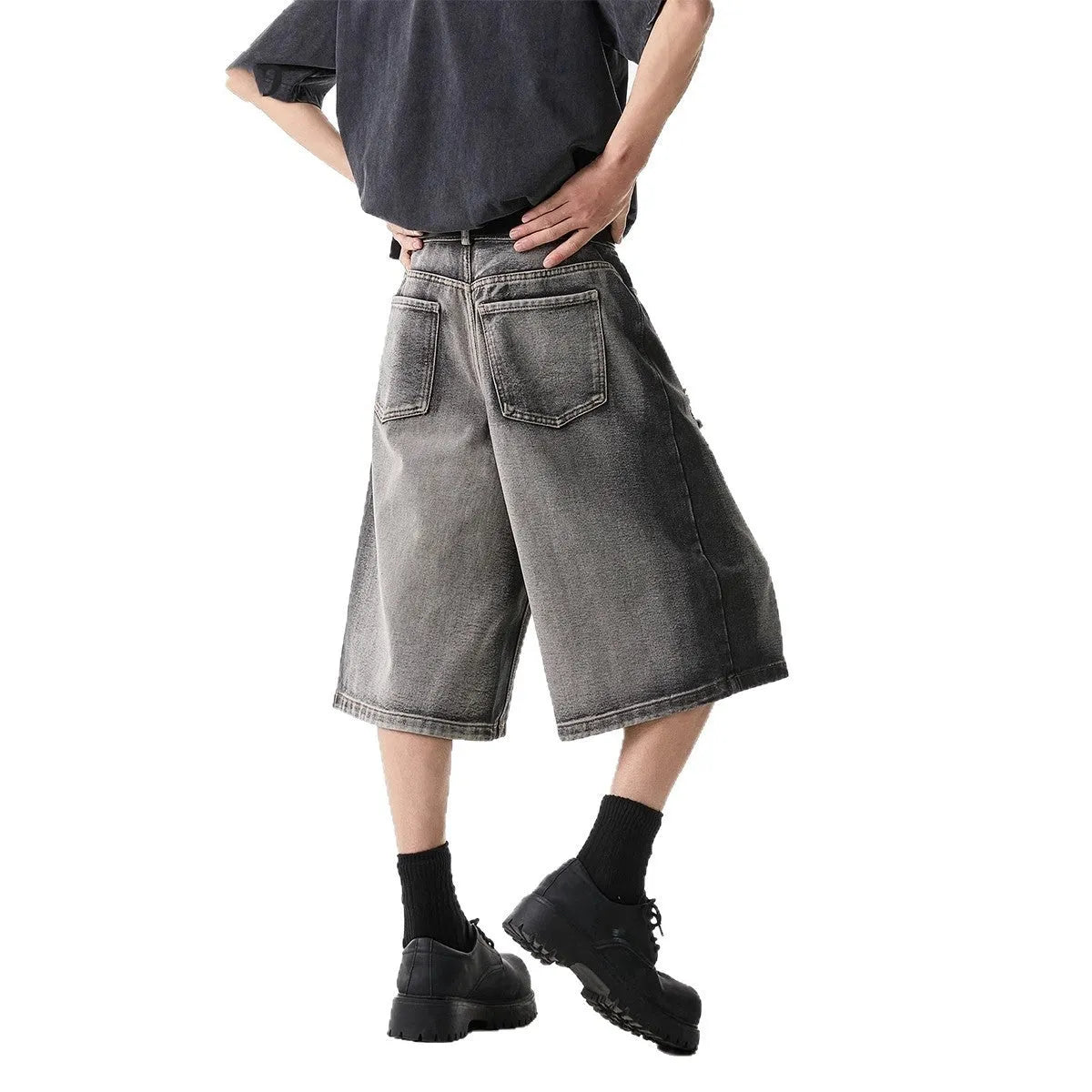 Grey water washed denim shorts with hole detailing and loose cropped fit