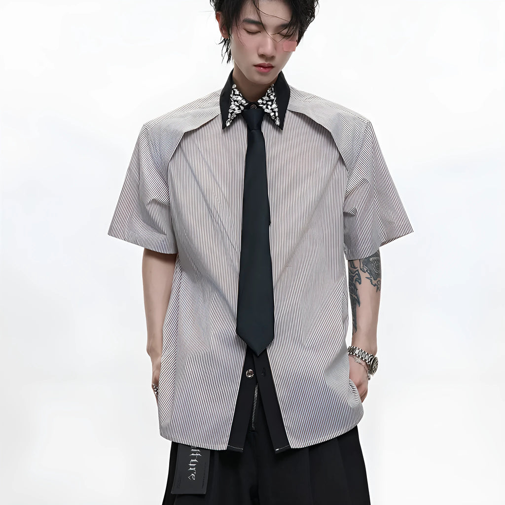 Men's blue and khaki patchwork striped shirt with diamond tie detail and quilted texture.