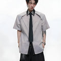 Men's blue and khaki patchwork striped shirt with diamond tie detail and quilted texture.