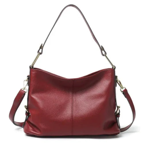 Square vertical genuine leather crossbody bag with multiple internal compartments including phone pocket.