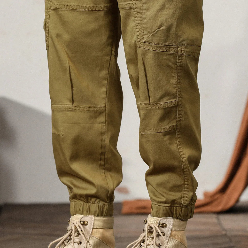 Men's cotton retro harem pants in tapered fit with ankle banding and zip fly