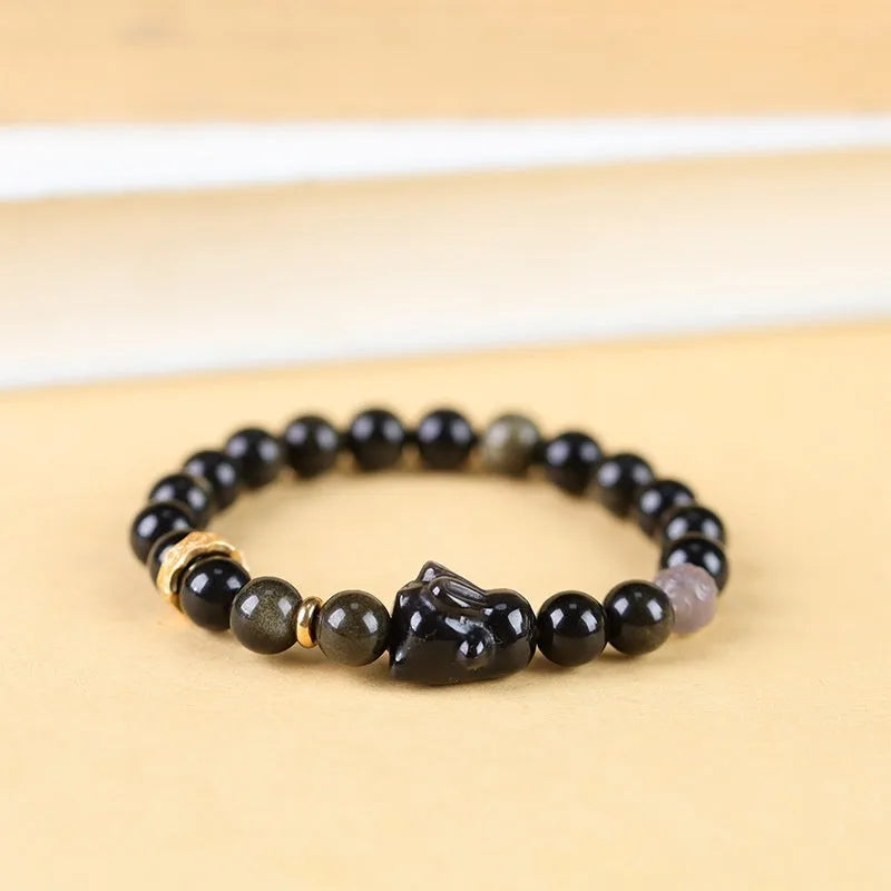Handmade national style bracelet with lying rabbit charm made from jin yaoshi, agate, and brass.