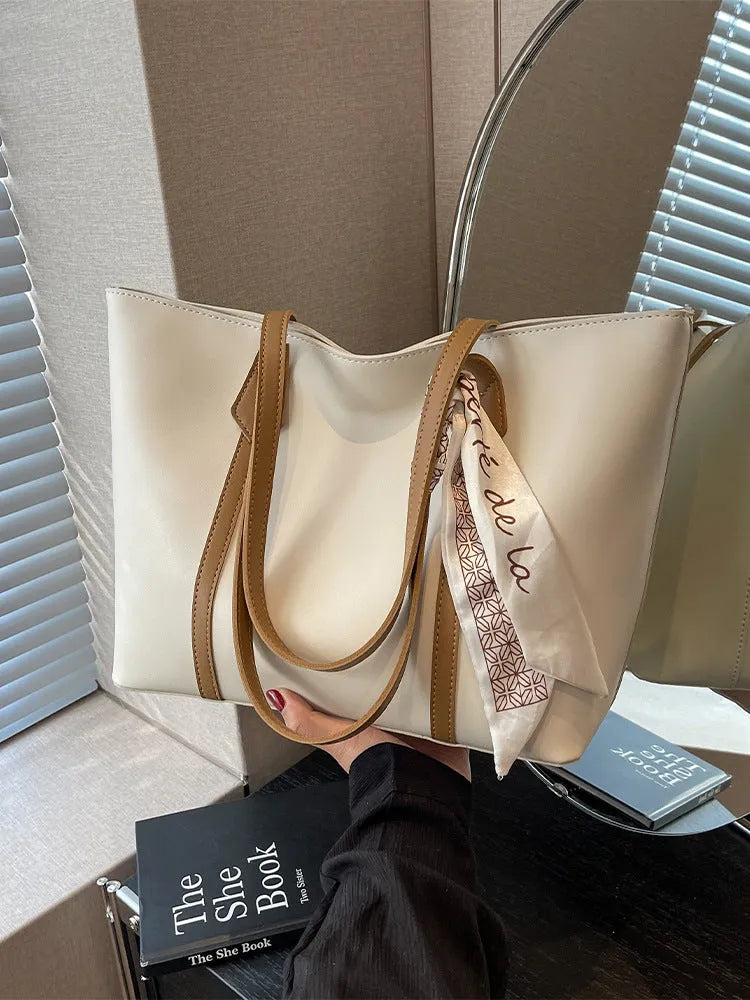 Women's soft large tote bag in a chosen colour, showing outer pockets and sewing detail.