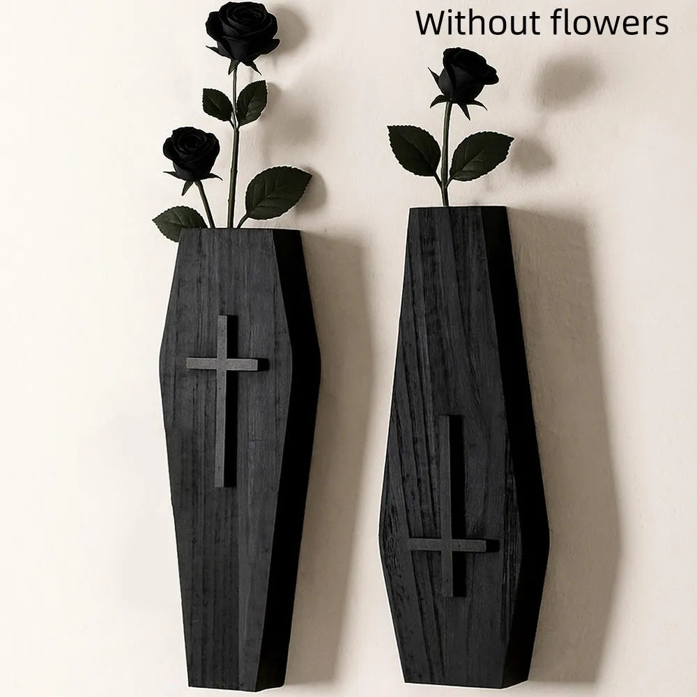Black cross-shaped wooden wall shelf for home decoration, measuring 27 by 9 centimetres.