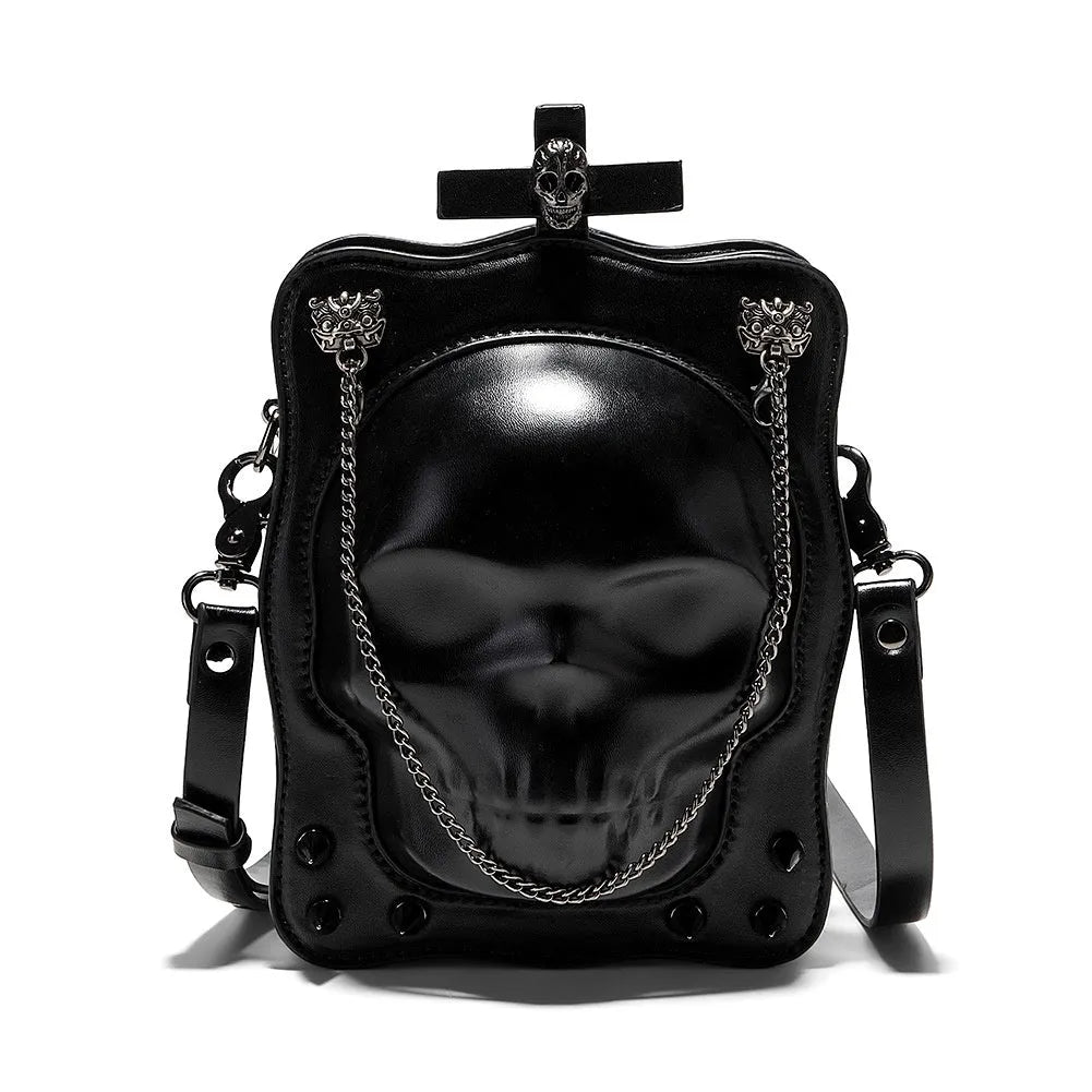 Black mini square crossbody bag with 3D embossed skull design, stitching details, and metal rivets