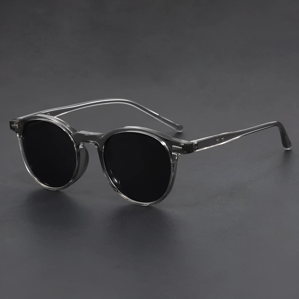 Retro oval sunglasses with ultra-lightweight round frame and polarised grey lenses.