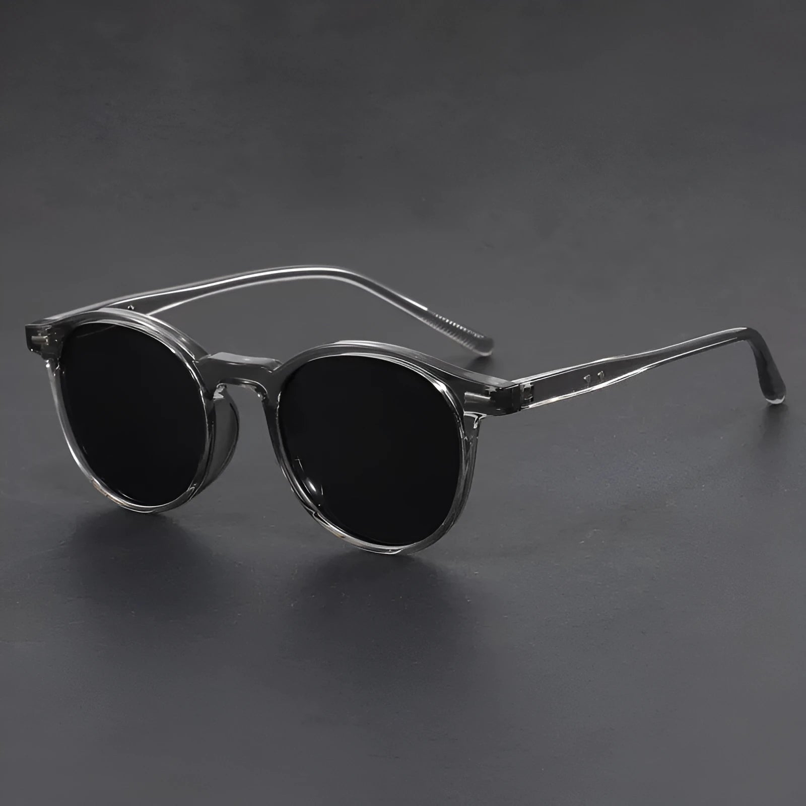Retro oval sunglasses with ultra-lightweight round frame and polarised grey lenses.