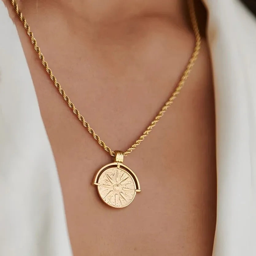 Gold titanium steel sunflower pendant necklace with geometric star embossing on adjustable hemp chain.