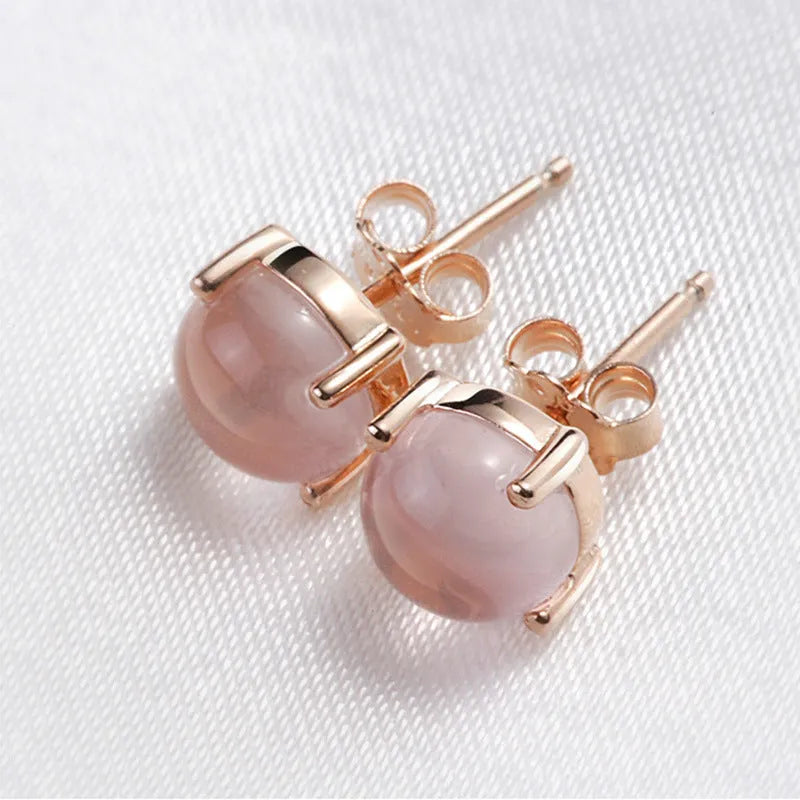 Rose gold coloured drop shaped stud earrings with synthetic ross quartz crystal inlay, Korean style design