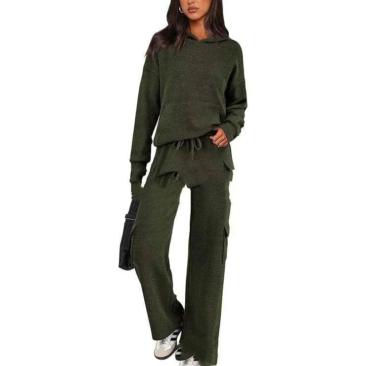 Women's two-piece leisure sports suit in polyester, showing long sleeve top and trousers in a solid colour.