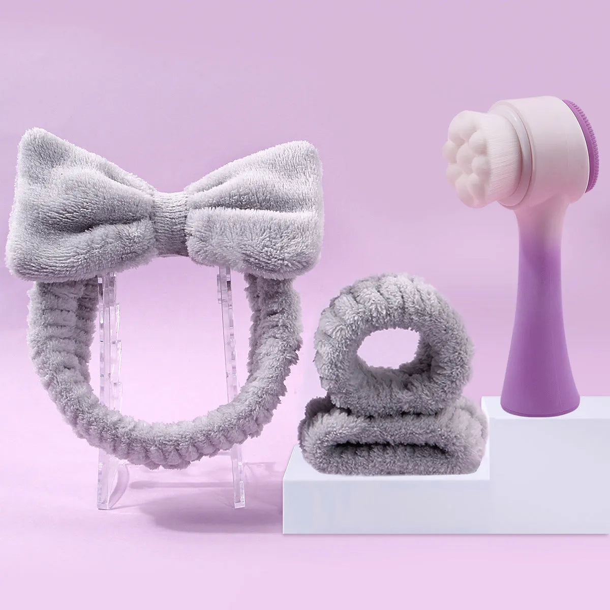 Facial brush and coral fleece hair band set in purple colour with plastic handle and nylon bristles