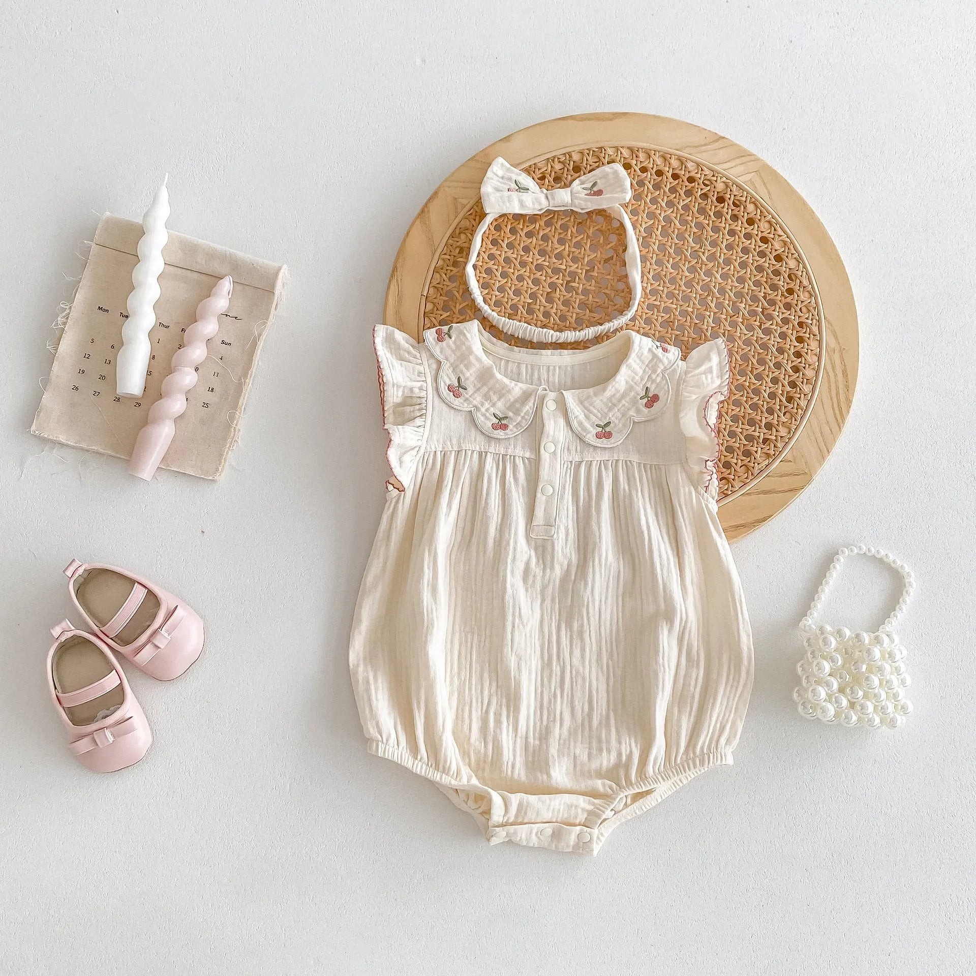 apricot cotton sleeveless double breasted baby jumpsuit with matching hair band