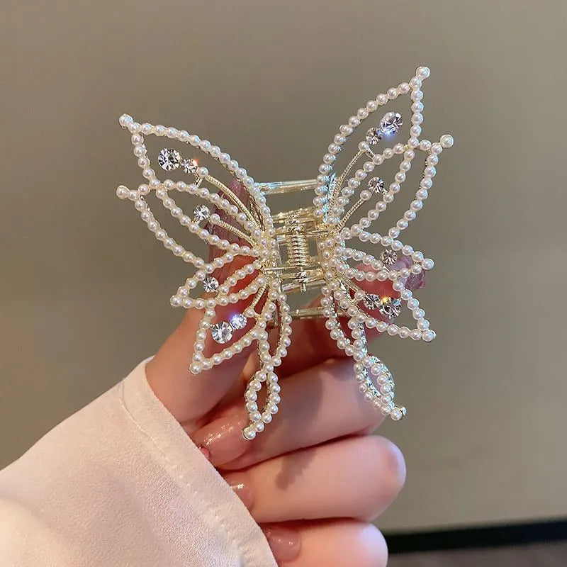 Butterfly hair barrettes in alloy measuring 6.7 by 6.2 cm with decorative elements