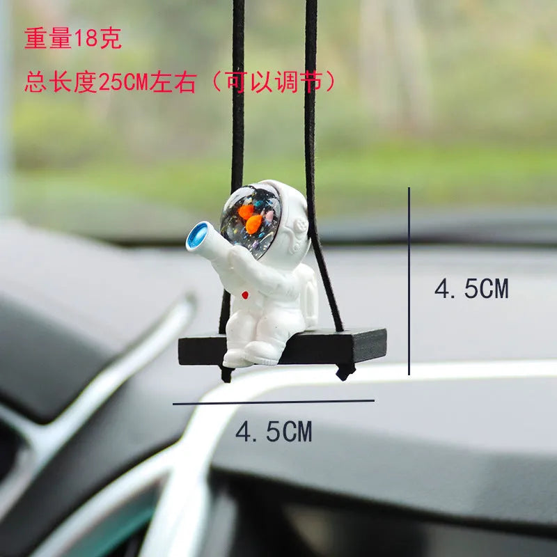 Resin cartoon astronaut car pendant available in red flag, telescope, and radish holding styles for dashboard decoration.