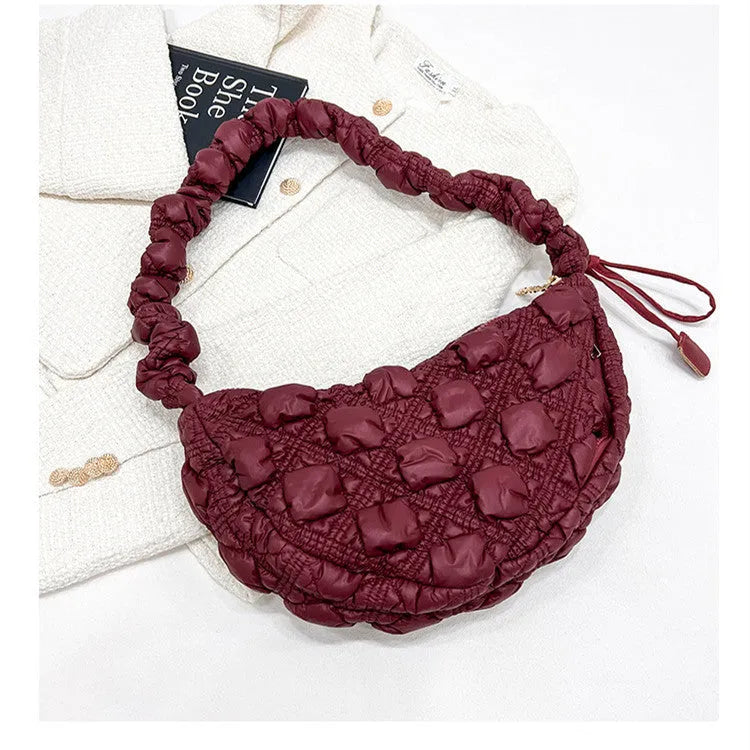Women's nylon shoulder messenger bag in a solid colour with a long strap, showing front view.