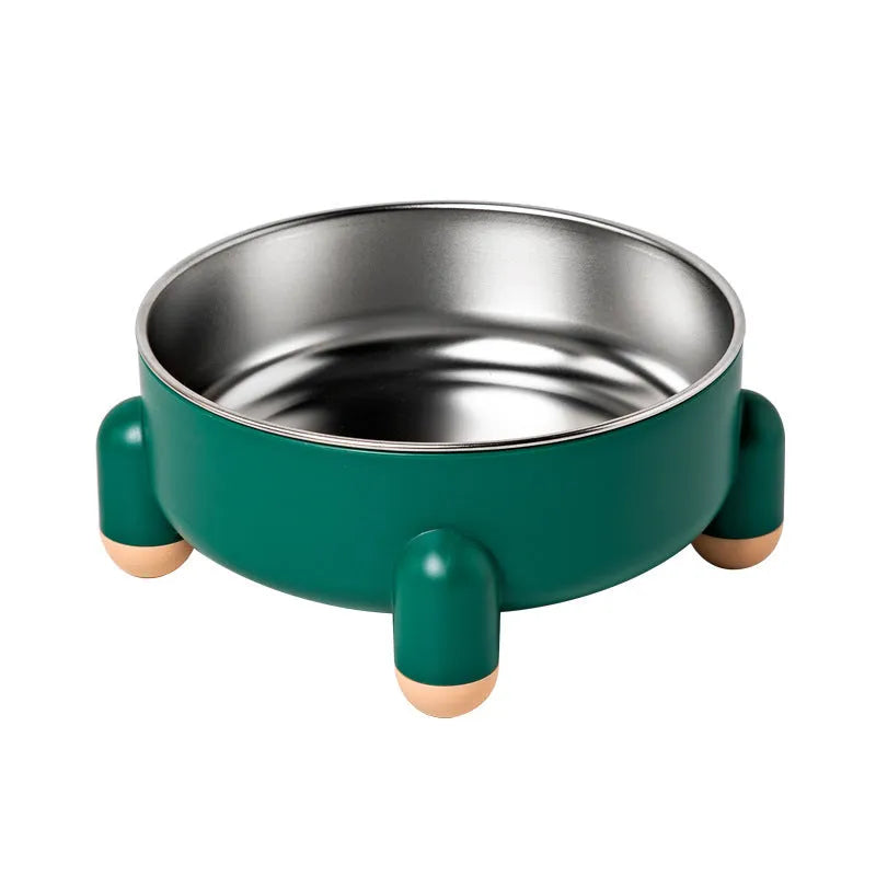 Green stainless steel pet bowl with a high foot and non-slip base on a kitchen floor.