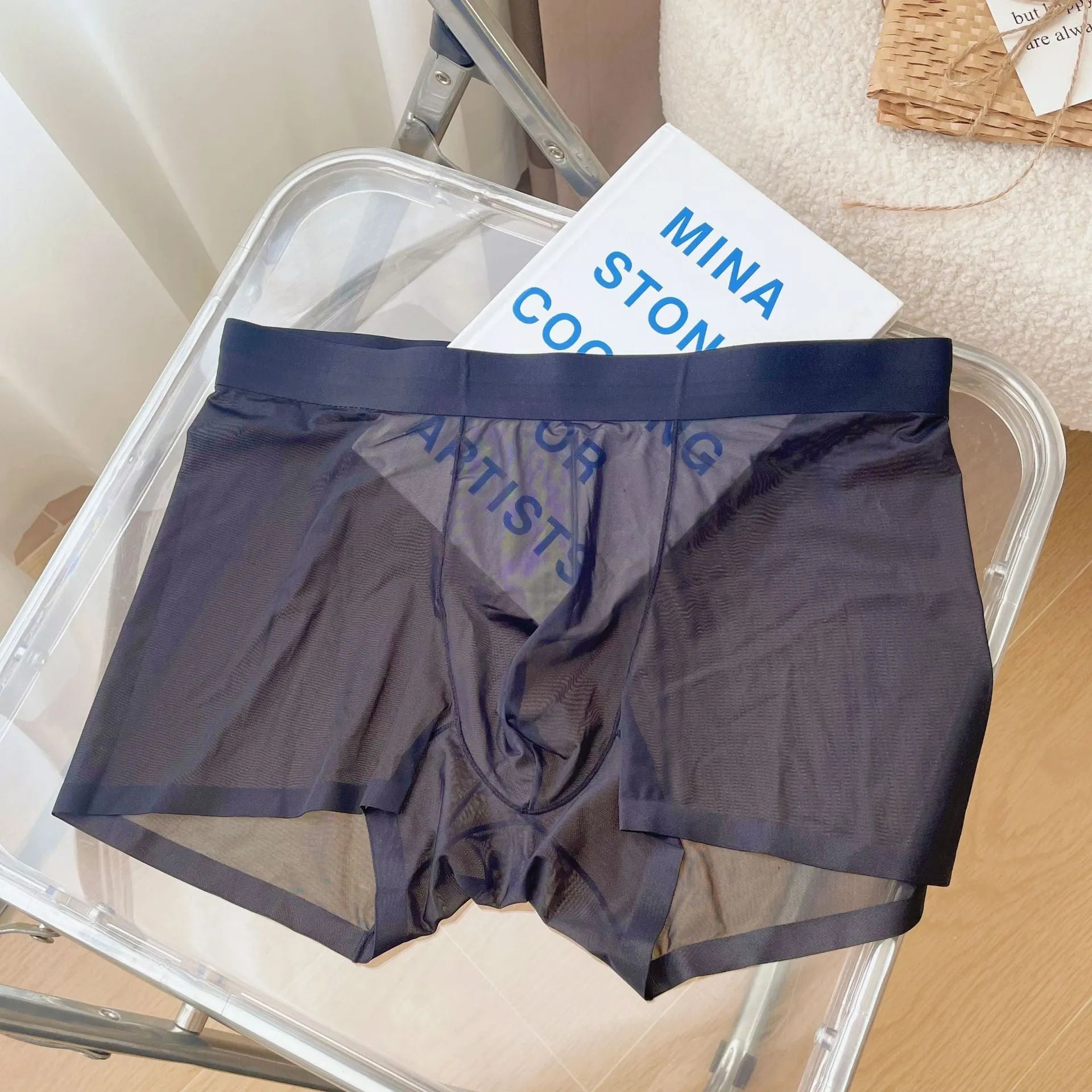 Thin breathable men's boxer shorts in seamless quick-drying nylon fabric showing mid waist design