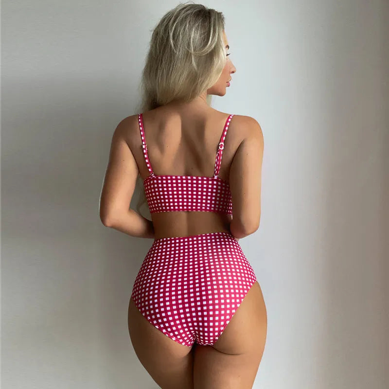 Women's plaid high-waist bikini swimsuit in rose red, showing the two-piece design and split-leg cut.