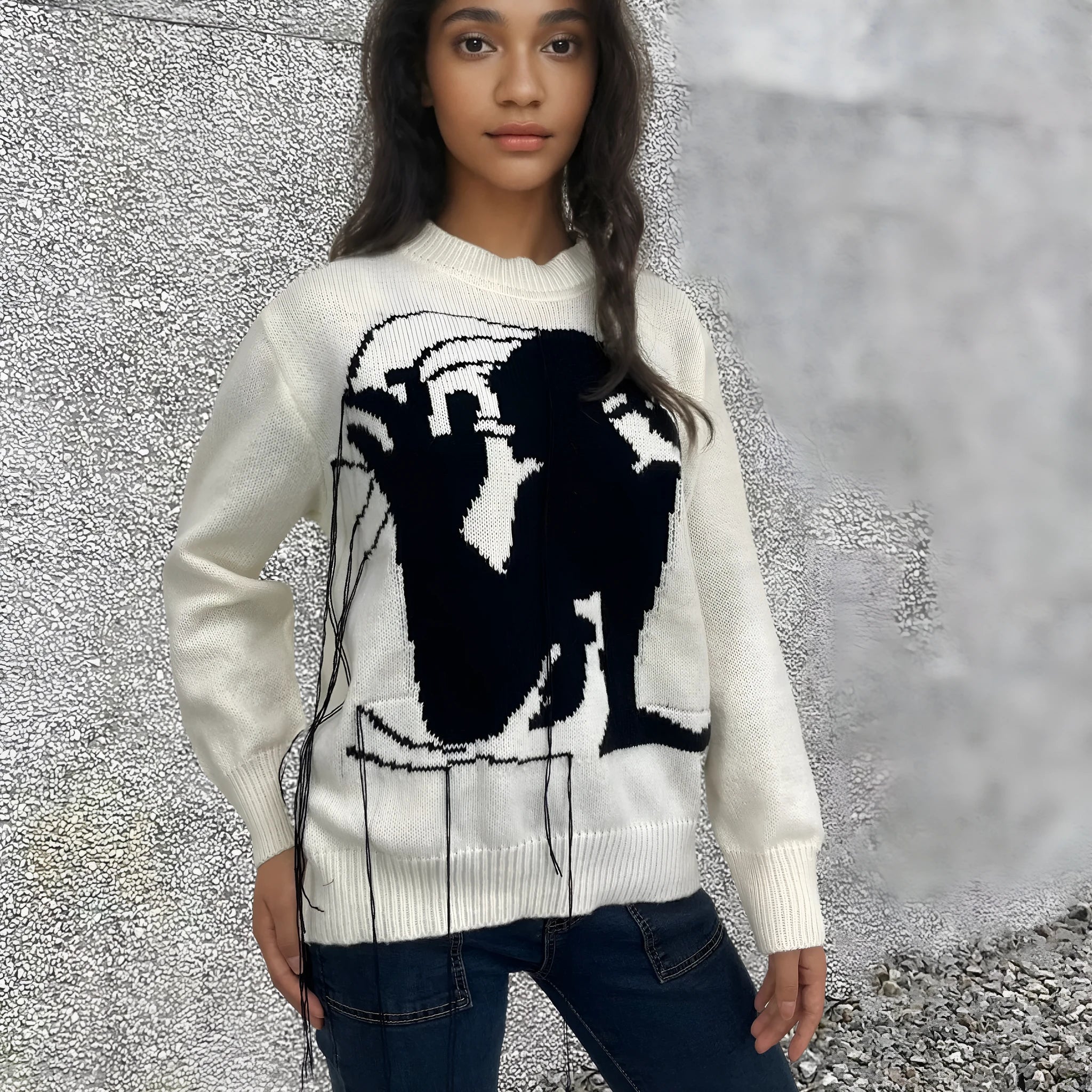 Women's loose fit alpaca wool sweater with tassel design and abstract pattern in street fashion style
