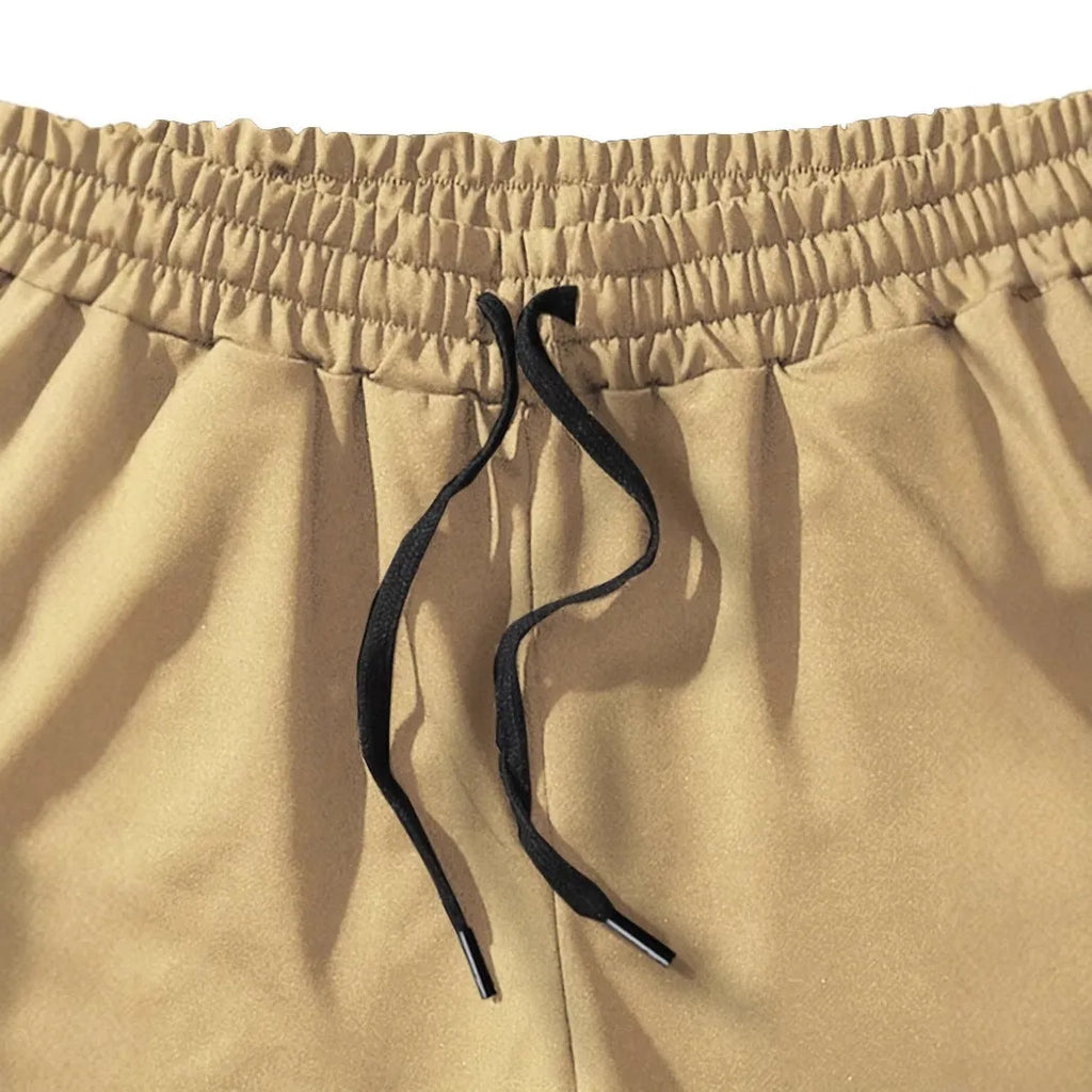 Men's khaki coconut printed sports shorts with straight leg design and micro elastic fabric