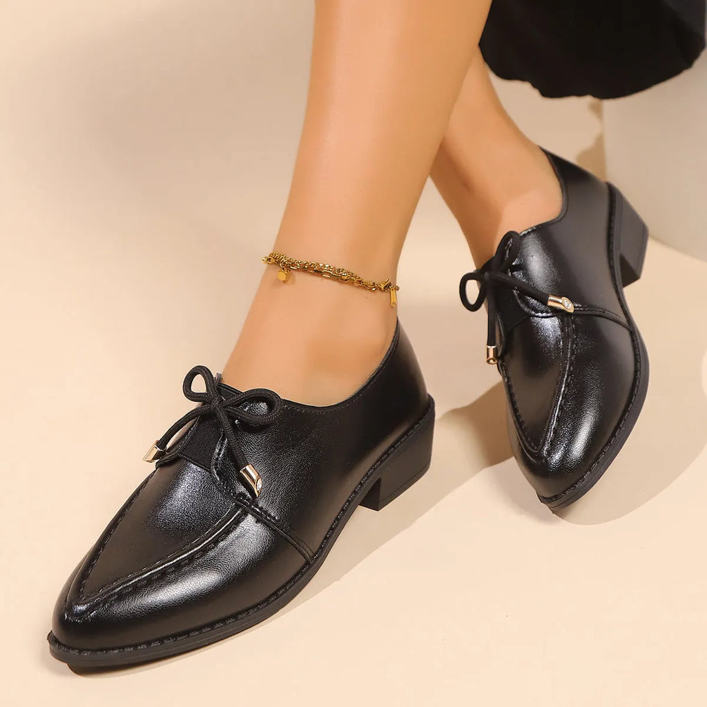 Women's British-style leather shoes with decorative bow on pointed toe, available in three bow style variations