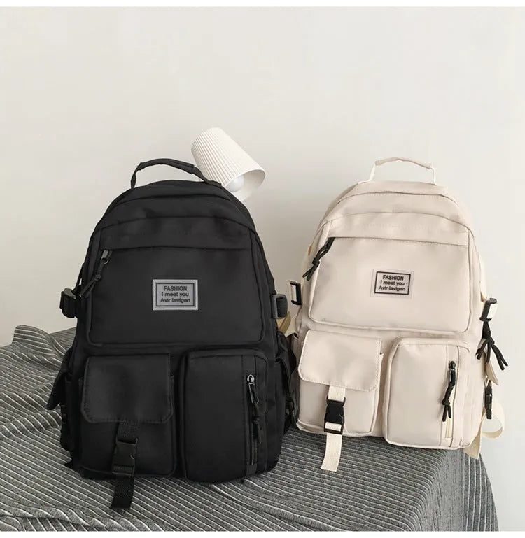 Black and white student backpack with computer compartment showing dimensions 31x12x41cm